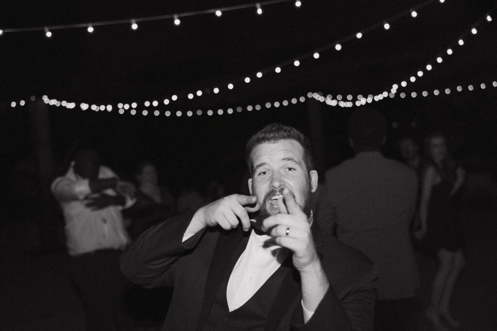 Groom partying at reception