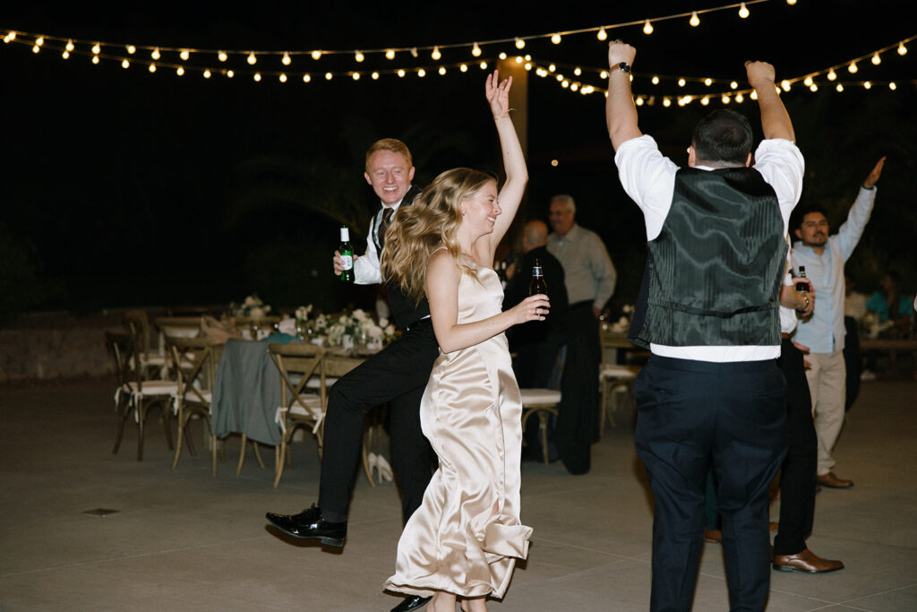 Wedding guests dancing at the reception