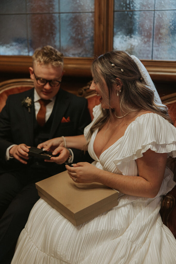 Bride and groom exchanging gifts