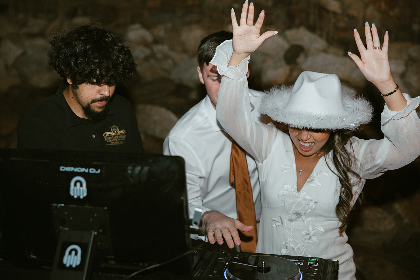 Bride and groom at dj booth