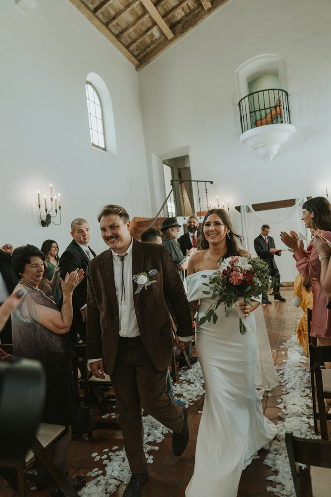 An indoor San Diego wedding ceremony at The Juniper Serra Museum