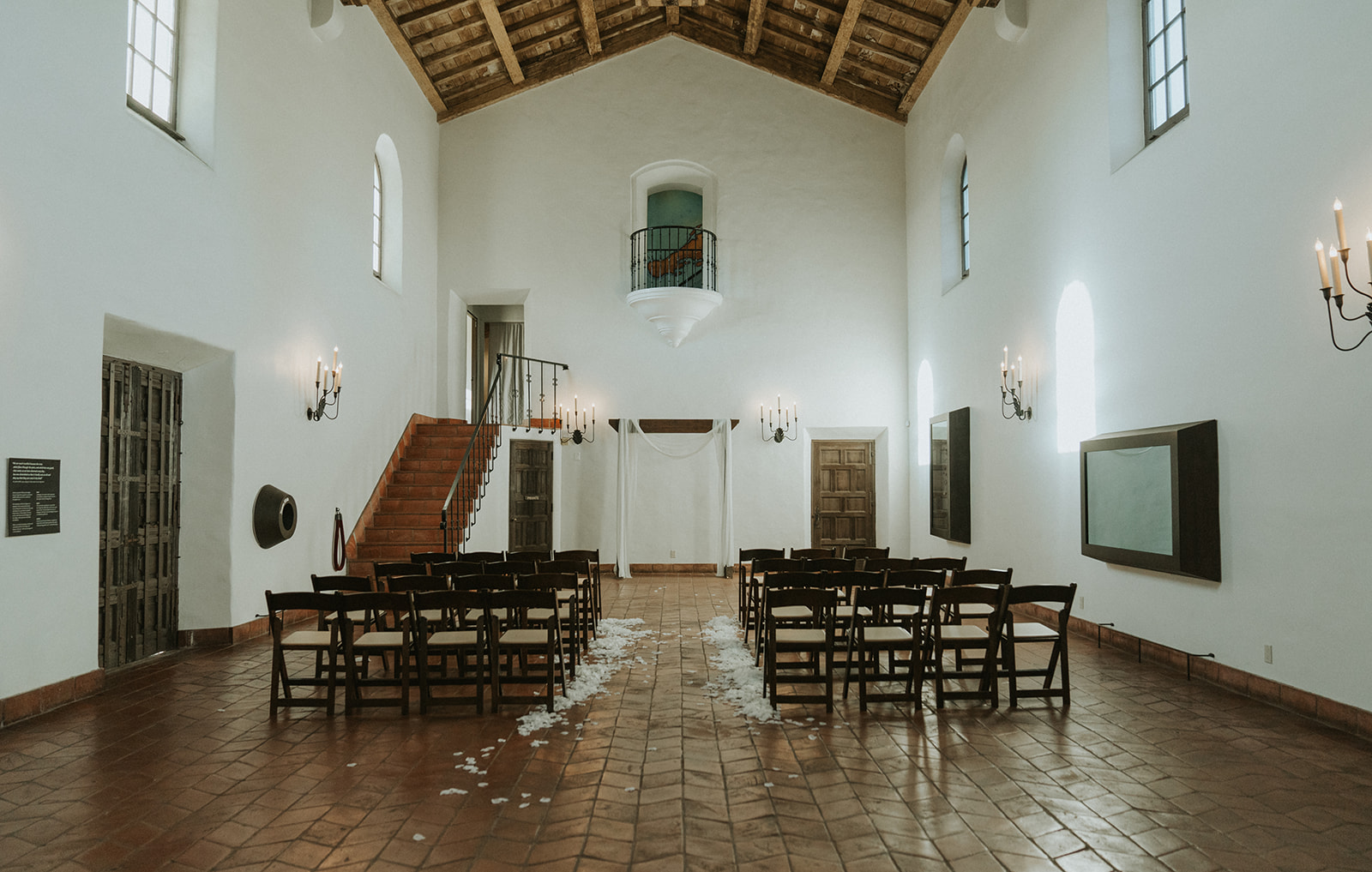 An indoor San Diego wedding ceremony at The Juniper Serra Museum
